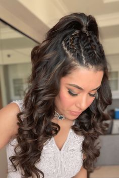 This half-up, half-down hairstyle features a crown of intricate braids, adding a bohemian-inspired touch to the overall aesthetic. Cascading waves flow down from the braided crown, framing the face with a romantic and soft vibe that would complement any prom gown. The hairstyle strikes a balance between detailed - Click to see more of Elegant and Effortless: 31 Stunning Half-Up Half-Down Hairstyles for Prom and follow us for more hairstyle ideas. // Photo Credit: Instagram @hairbyminimahadik Half Curls Hairstyles, Navratri Hairstyles Ponytail, Curl Hairstyles With Braids, Half Ponytail With Braid, Hairstyles Easy For Wedding, Short Hair Hairstyles For Curly Hair, Simple Hairstyles For Long Hair For Wedding, Hairstyles For Choli, Braided Ponytail Hairstyles Wedding