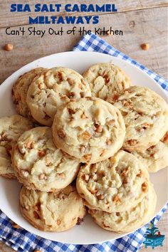 a white plate topped with cookies on top of a blue and white checkered table cloth