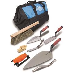 garden tools are laid out in front of a black duffel bag on a white background