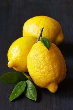 two lemons sitting on top of each other with the words diy lemon hand scrub