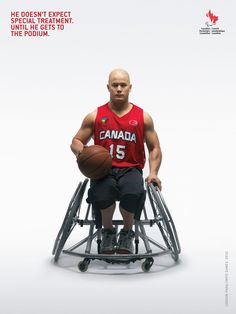 a man in a wheelchair holding a basketball