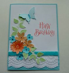 a birthday card with flowers and butterflies on it