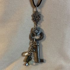 I Am Listing A Few Key Necklaces That Are Similar - This One Is Number 6. All Of Them Are Unique. This Is An Antique Key That Is On A Brown Suede Cord With A Cluster Of Beads. I Used Antiqued Silver Colored Charms And Links To Create This Necklace. Beads Are Crystal And Also Luster Finish Glass. This Is A New Item And Never Worn. The Key Pendant Portion Is 3 Inches Long And The Cord Is About 25 Inches Long Antique Key Necklace, Key Necklaces, Key Jewelry, Antique Keys, Necklace Beads, Jewelry Antique, Number 6, Pendent Necklace, Suede Cord