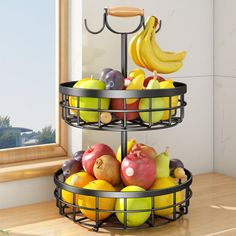 two tiered metal fruit basket with apples, pears and bananas