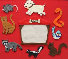 an image of felt animals on a red background