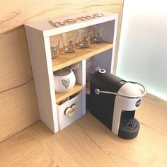 a 3d image of a coffee maker and glasses in a cabinet with the word love written on it