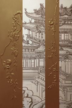 three panels with gold designs on them in front of a white wall and brown background