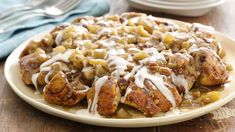 a white plate topped with french toast covered in icing