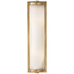 an outdoor wall light with glass panels on the front and back sides, in brass finish