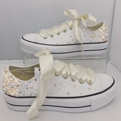 Converse Platforms embellished with : - Fully embellished backstrips with Champagne and Rose Gold Pearls and Gold and Clear Swarovski crystals - Pearls and Swarovski crystals embellished on the outsides of the shoes in a spray gradual fade effect - Finished with Beautiful full Ivory satin laces Embellished Low-top Wedding Sneakers, Embellished Lace-up Sneakers For Weddings, Wedding Sneakers For Bride, Bedazzled Converse, Converse Platforms, Sparkly Converse, Converse Wedding, Converse Wedding Shoes, Bedazzled Shoes