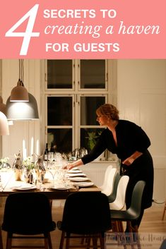 a woman setting a table with wine glasses on it and the words 4 secrets to creating a haven for guests