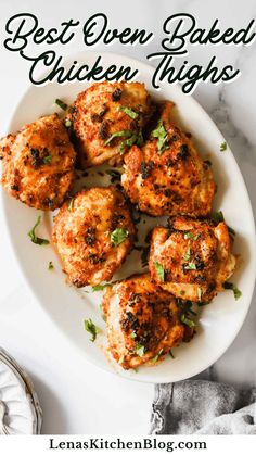 the best oven baked chicken thighs on a white plate