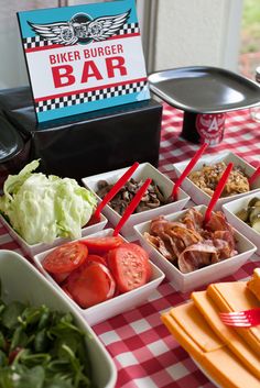 an image of a birthday party with food on the table and in front of it