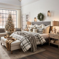 a bedroom decorated for christmas with a large bed