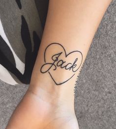 a woman's arm with a tattoo that says jack on it and a heart in the middle