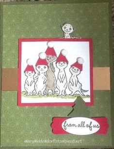 a handmade card with cats and gnomes on it, the cat is holding a sign