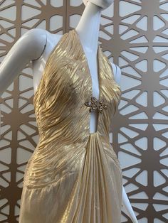 Gold Luxury Gown With Fitted Bodice, Fitted Luxury Gold Gown, Gold Fitted Luxury Gown, Luxury Fitted Gold Gown, Luxury Gold Evening Dress With Fitted Bodice, Luxury Gold Evening Dress, Gold Backless Evening Dress For Wedding, Luxury Halter Neck Evening Dress For Wedding, Luxury Gold Floor-length Evening Dress