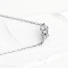 Our sparkling Olivia necklace features nine natural VS quality round brilliant cut diamonds prong set in 14K Solid Gold along with a sturdy 1.3mm cable chain and lobster clasp for additional security. The largest are 2mm diamonds and the smallest being 1mm diamonds. This feminine necklace is available in 14K Solid Yellow and White Gold. ✨ Features ✨• Ships Next Day / Fedex 2 Day Service• Made in the USA.• Gold : Solid 14K• Choice of Gold: Yellow Gold, White Gold• Diamond Cut: Round• Total Diamon Cubic Zirconia Diamond Necklace With Cable Chain For Gift, Wedding Jewelry With Diamond Cable Chain, Gift Diamond Necklace With Cable Chain And Round Cut, Gift Round Cut Diamond Necklace With Cable Chain, Olivia Necklace, Diamond Cluster Necklace, Feminine Necklace, Cluster Necklace, Bracelet Collection