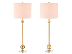 pair of brass table lamps with white shades