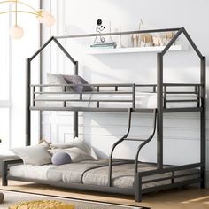 a metal bunk bed with a house shaped mattress on the bottom, and pillows below