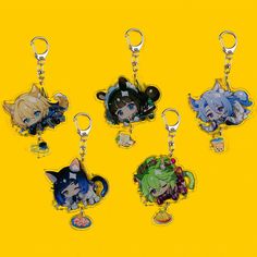 four key chains with anime characters on them