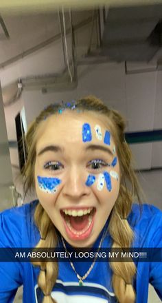 School Cheer Makeup, Face Paint Team Spirit, Face Paint For Fnl, Blue School Spirit Outfits, Homecoming Game Face Paint, Blue Out Game Outfit, Spirit Day Face Paint Ideas