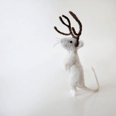 a needled mouse with antlers on it's head is shown in front of a white background