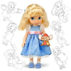 a doll with blonde hair and blue dress holding a teddy bear in her hand on a white background