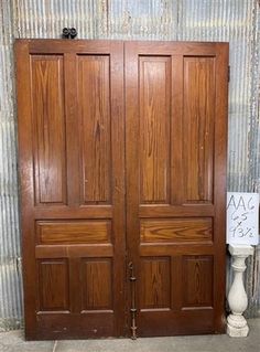 two brown wooden doors sitting next to each other