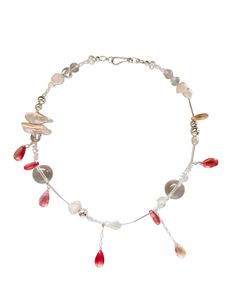 a silver bracelet with red and white beads