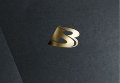 a black and gold logo with the letter s in it's center is shown