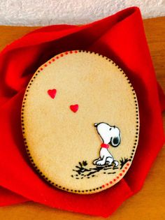 a red cloth with a snoopy dog on it