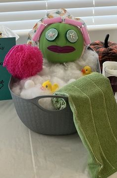 a bathtub filled with foam and toys on top of a table