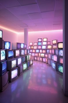 a room filled with lots of tvs sitting next to each other