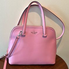 Kate Spade Dome Top Satchel Crossbody Bag Handbag Shoulder Bag Purse Nwot New Without Tags No Callouts No Flaws Powder Pink Genuine, Leather Goldtone Hardware & Accents Adjustable & Removable Crossbody Strap +\-3” Front Has Pin Mount Kate Spade New York In Goldtone 4 Goldtone Feet On Bottom Zipper Top Closure/Matching Leather Pull Clean Interior Lined In Powder, Pink/ Imprint Inside Contains 1 Zippered Pocket/Leather Pull Below Is Kate Spade New York Imprinted In Gold Foil On Leather Patch 2 Sli Pink Handheld Bag For On-the-go, Classic Pink Handheld Shoulder Bag, Pink Top Handle Shoulder Bag, Classic Pink Shoulder Bag With Removable Pouch, Classic Pink Bag With Top Carry Handle, Classic Pink Shoulder Bag With Detachable Strap, Pink Handheld Satchel With Adjustable Strap, Classic Pink Shoulder Bag, Pink Satchel Bag With Adjustable Strap