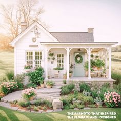 a small white house with steps leading to the front door and flowers on the porch