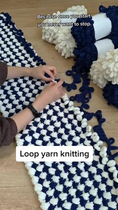 a woman is knitting on a rug with yarn and scissors in front of her, next to the words loop yarn knitting