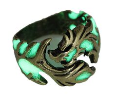 PRICES MAY VARY. ❀【Fashion Cool Ring】This is a Vintage Gothic Dragon ring for men and women that can glow in the dark and emit a unique light, making you the focus of the crowd. Put it under sunlight or any light for a few minutes and it glows brilliantly in the dark. ❀【Premium & Hypoallergenic】Environmentally friendly zinc alloy material and exquisite craftsmanship. It is modern, stylish, skin-friendly, hypoallergenic, and can be worn with confidence, which is an intricate band that resembles t Dark Rings, Copper Dragon, Flying Dragon, Dragon Ring, Bronze Ring, Rings Jewelry Fashion, Luminous Colours, Finger Rings, American Standard