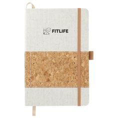 a white and brown notebook with cork cover