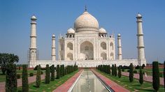 a large white building with many pillars around it