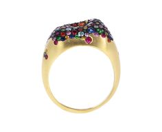 With its modern design and shimmering rainbow sapphires, this Nada Ghazal ring is a playful take on the traditional cocktail ring. The three dimensional blackened 18K yellow gold ring face is encrusted in a surface of sparkling rainbow sapphire pavé and sits at the center of the 18K yellow gold band. As a middle finger ring it will command attention, but it could also be worn as an alternative to the traditional engagement ring for someone with an edgy, modern style. 18K yellow gold ring face : Traditional Engagement Ring, Digby And Iona, Traditional Engagement, Middle Finger Ring, Traditional Engagement Rings, Rainbow Sapphires, Semi Precious Gems, 18k Yellow Gold Ring, Precious Gems