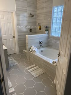 the bathroom is clean and ready to be used as a bathtub or shower stall