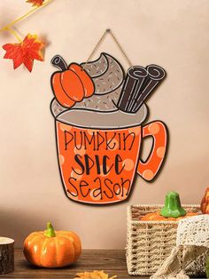 a pumpkin spice season sign hanging on a wall