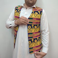 Beautiful Afghani Multi color waistcoat gold tune work. Our amazing embroidered Afghani waistcoat is the absolute ultimate . And the colors will knock your socks off. Embroider the hell out of them. And you get this, an extraordinary piece of outerwear for Men And Women. We Deliver Worldwide . Festive Vest With Multicolor Embroidery, Festive Embroidered Multicolored Vest, Festive Embroidered Vest With Multicolor Embroidery, Traditional Fitted Multicolor Vest, Traditional Cotton Vest For Festivals, Fitted Traditional Multicolor Vest, Embroidered Multicolor Vest For Festivals, Traditional Embroidered Festive Vest, Festive Embroidered Cotton Vest