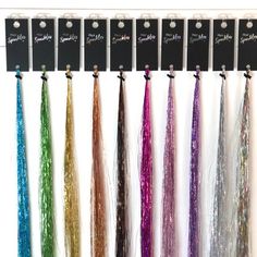 If you are looking to add Hair Sparkles® as a service at your salon, our professional system offers the highest grade strands you will find. We offer a range of 34 stunning colours and our Sparkles are lightweight, 40 inches long, heat- and colour-resistant (except the Pearl variety which cannot be heat-styled). We have designed a hanging tag to help keep your strands organised and tidy. Our exclusive display solution is designed to look neat, attractive and professional; the crystal clear hangi Hair Sparkles, Amber Hair, Hair Extension Shop, Diamond Hair, Hair Tinsel, Fairy Hair, Rose Gold Hair, Popular Color, Heat Styling Products