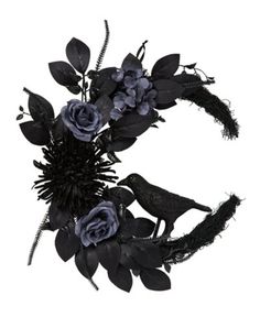 a black wreath with purple flowers and birds on the top, surrounded by leaves and feathers