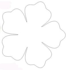 a four leaf clover cut out on a piece of paper with the outlines drawn