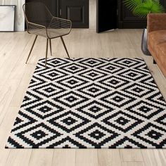 a black and white rug in a living room