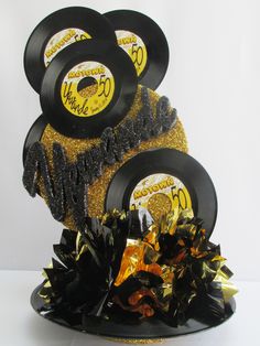 a cake with black and gold decorations on it