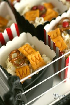 small trays filled with food on top of a table